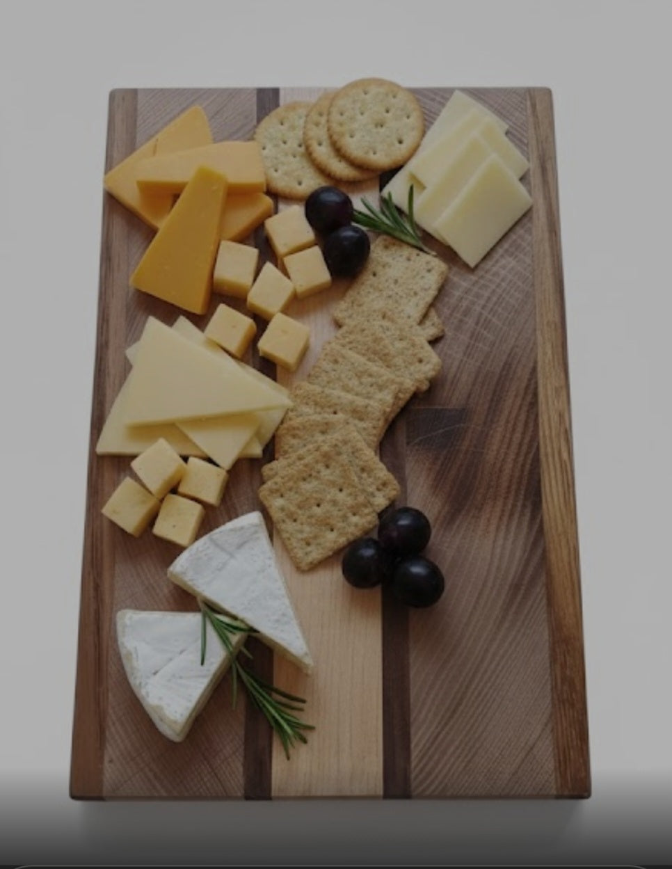 A handmade cheese board (Sycamore, Sapele, Walnut and maple)